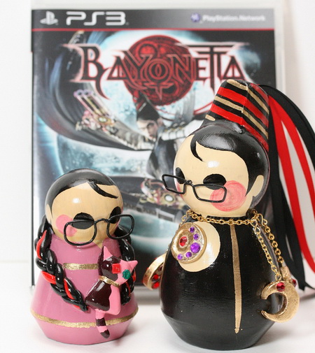 Bayonetta и Cereza на фоне PS3 диска
